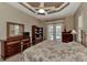 Bright bedroom with a floral comforter and backyard access at 4233 Grosse Pointe Dr, Port Charlotte, FL 33953
