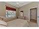 Well-lit bedroom with two twin beds and access to a bath at 4233 Grosse Pointe Dr, Port Charlotte, FL 33953