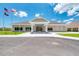 Community center exterior featuring a welcoming entrance and landscaping at 4233 Grosse Pointe Dr, Port Charlotte, FL 33953