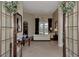 Spacious foyer with double doors offering views of the living room and backyard at 4233 Grosse Pointe Dr, Port Charlotte, FL 33953
