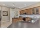 Kitchen with island, stainless steel appliances, and light wood cabinets at 4233 Grosse Pointe Dr, Port Charlotte, FL 33953