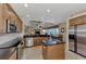 Island kitchen with stainless steel appliances and breakfast bar at 4233 Grosse Pointe Dr, Port Charlotte, FL 33953