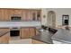 Large kitchen with island, ample cabinetry, and stainless steel appliances at 4233 Grosse Pointe Dr, Port Charlotte, FL 33953
