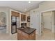 Modern kitchen with breakfast bar and view of the pool and lake at 4233 Grosse Pointe Dr, Port Charlotte, FL 33953
