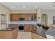 Open concept kitchen with island and stainless steel appliances at 4233 Grosse Pointe Dr, Port Charlotte, FL 33953