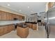 Open kitchen with large island, stainless steel appliances, and views to the living room at 4233 Grosse Pointe Dr, Port Charlotte, FL 33953