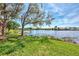 Scenic view of lake and lush green landscape at 4233 Grosse Pointe Dr, Port Charlotte, FL 33953