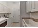 Laundry room with washer, dryer, and utility sink at 4233 Grosse Pointe Dr, Port Charlotte, FL 33953