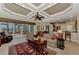 Bright and airy living room with coffered ceiling, comfortable seating and views of the pool at 4233 Grosse Pointe Dr, Port Charlotte, FL 33953