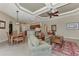Open living space with coffered ceiling, comfortable seating and access to kitchen and dining area at 4233 Grosse Pointe Dr, Port Charlotte, FL 33953