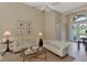 Spacious living room with tiled floors, comfy sofas, and access to the backyard pool at 4233 Grosse Pointe Dr, Port Charlotte, FL 33953