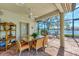 Outdoor patio with wicker furniture and a view of the lake at 4233 Grosse Pointe Dr, Port Charlotte, FL 33953
