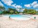 Community pool with a separate shallow area at 4233 Grosse Pointe Dr, Port Charlotte, FL 33953