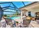Enjoy this relaxing pool and patio area with lake views at 4233 Grosse Pointe Dr, Port Charlotte, FL 33953