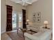Bright sitting room with French doors opening to a pool and patio view at 4233 Grosse Pointe Dr, Port Charlotte, FL 33953