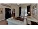 Spacious sitting area with French doors opening to a pool and patio view at 4233 Grosse Pointe Dr, Port Charlotte, FL 33953