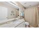 Bright bathroom featuring a shower/tub, vanity with a granite countertop at 4260 Placida Rd # 12C, Englewood, FL 34224