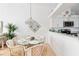 Bright dining area with glass top table and wicker chairs near kitchen at 4260 Placida Rd # 12C, Englewood, FL 34224