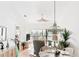 Bright dining area with glass table and wicker chairs at 4260 Placida Rd # 12C, Englewood, FL 34224