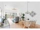 Bright dining area with glass top table and wicker chairs near living room at 4260 Placida Rd # 12C, Englewood, FL 34224