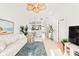 Living room boasts comfy seating, large TV, and access to a balcony at 4260 Placida Rd # 12C, Englewood, FL 34224