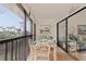 Enjoy outdoor dining on this screened balcony at 4260 Placida Rd # 12C, Englewood, FL 34224