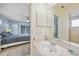 Bathroom features a vanity and offers access to the bedroom at 4490 Gillot Blvd, Port Charlotte, FL 33981