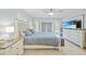 Main bedroom features a king-size bed and lots of natural light at 4490 Gillot Blvd, Port Charlotte, FL 33981