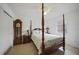 Bedroom with a charming four-poster bed and ample closet space at 4490 Gillot Blvd, Port Charlotte, FL 33981