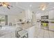 Modern kitchen featuring white cabinets and granite island at 4490 Gillot Blvd, Port Charlotte, FL 33981