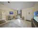 Living room with tiled floors and access to bathroom at 4490 Gillot Blvd, Port Charlotte, FL 33981