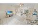 Open living space with tile flooring and a large TV at 4490 Gillot Blvd, Port Charlotte, FL 33981