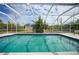 Inviting screened pool with tile accents at 4490 Gillot Blvd, Port Charlotte, FL 33981