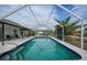 Refreshing screened pool with patio seating at 4490 Gillot Blvd, Port Charlotte, FL 33981