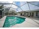 Screened-in pool with large patio area at 4490 Gillot Blvd, Port Charlotte, FL 33981