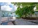 Charming backyard with gravel, seating area, and lush landscaping at 45 Friendship Ln, Englewood, FL 34223