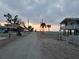 Sunrise over the beach with a golf cart at 45 Friendship Ln, Englewood, FL 34223