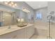 Double vanity bathroom with soaking tub and walk-in shower at 4628 Club Dr # H201, Port Charlotte, FL 33953