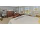 Main bedroom with king-size bed and built-in shelving at 4628 Club Dr # H201, Port Charlotte, FL 33953