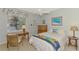 Bedroom with desk, chair, and full-size bed at 4628 Club Dr # H201, Port Charlotte, FL 33953