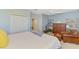 Main bedroom with king-size bed and sitting area at 4628 Club Dr # H201, Port Charlotte, FL 33953