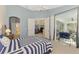 Relaxing bedroom with access to a private balcony and bathroom at 4628 Club Dr # H201, Port Charlotte, FL 33953