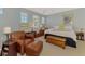 Main bedroom with king-size bed and seating area at 4628 Club Dr # H201, Port Charlotte, FL 33953
