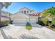 Tan three-story townhome with two-car garage and manicured lawn at 4628 Club Dr # H201, Port Charlotte, FL 33953