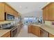 Modern kitchen with stainless steel appliances and water views at 4628 Club Dr # H201, Port Charlotte, FL 33953