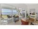 Living area with sliding doors leading to a waterfront patio at 4628 Club Dr # H201, Port Charlotte, FL 33953