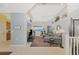 Living room with water views, comfortable seating, and built-in shelves at 4628 Club Dr # H201, Port Charlotte, FL 33953