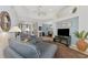 Bright living room with comfy seating and a view to the dining area at 4628 Club Dr # H201, Port Charlotte, FL 33953