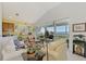Living room with water views and access to a balcony at 4628 Club Dr # H201, Port Charlotte, FL 33953