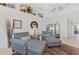 Cozy living room with comfortable seating and built-in shelves at 4628 Club Dr # H201, Port Charlotte, FL 33953